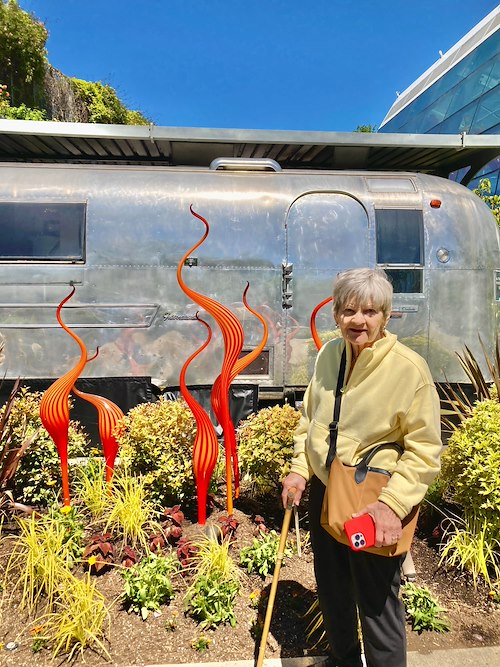 Fieldstone Memory Care of Bainbridge resident smiles as she enjoys a trip to see amazing art