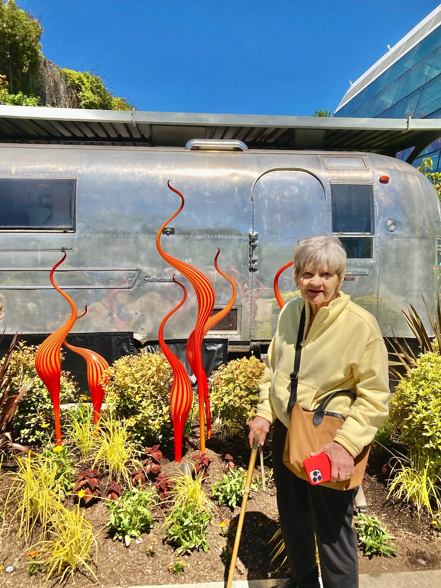 Fieldstone Memory Care of Bainbridge resident smiles as she enjoys a trip to see amazing art