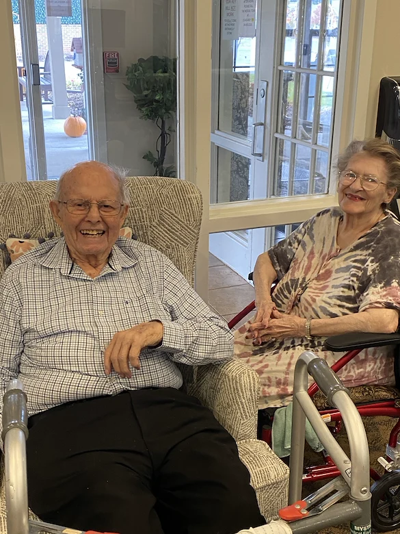 American House Stone senior living community offering independent living and respite care in Rochester Hills, MI, residents smiling and enjoying each others' company