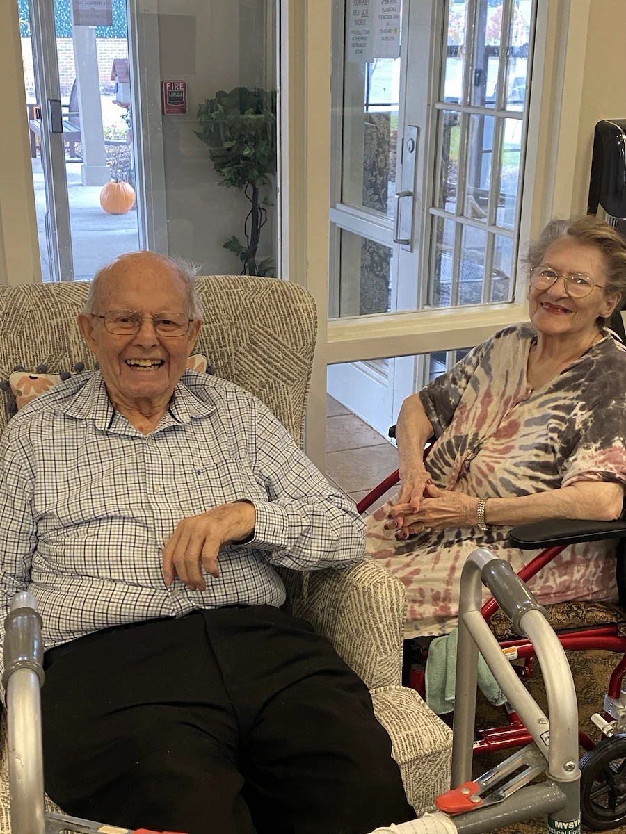 American House Stone senior living community offering independent living and respite care in Rochester Hills, MI, residents smiling and enjoying each others' company