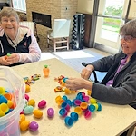 The Village at Keizer Ridge Assisted Living and Memory Care residents smiling while getting ready to celebrate Easter