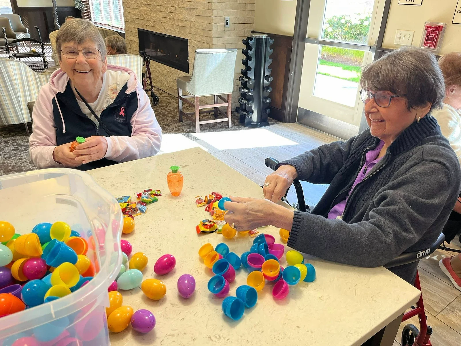 The Village at Keizer Ridge Assisted Living and Memory Care residents smiling while getting ready to celebrate Easter