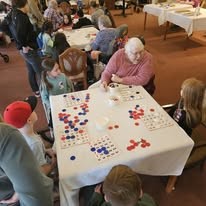 Gilman Grove Assisted Senior Living in Oregon City, Oregon resident playing a game with kids
