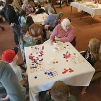 Gilman Grove Assisted Senior Living in Oregon City, Oregon resident playing a game with kids