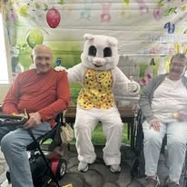 Avamere at Englewood Heights senior living community offering assisted living, memory care, and respite care in Yakima, WA, residents taking a picture with the Easter bunny