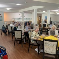 Mercy Village residents socializing and celebrating Mother's Day