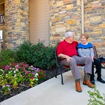 couple sitting on a bench at Franklin Park Boerne