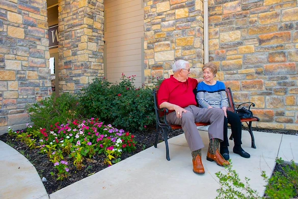 couple sitting on a bench at Franklin Park Boerne