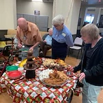 Pioneer Valley Lodge Gracious Retirement Living Hawthorn Senior Independent Living in North Logan, Utah residents getting snacks