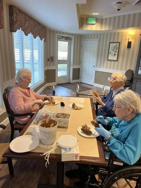 Viva Senior Living residents crafting some bird feeders