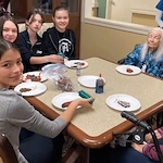 Middle School Students Visit Willowbrook Place Residents for an Early Holiday Celebration