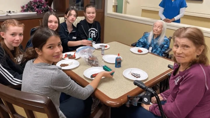 Middle School Students Visit Willowbrook Place Residents for an Early Holiday Celebration