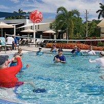John Knox Village Of Florida, Inc. CCRC senior living in Pompano Beach, FL residents playing pool volleyball