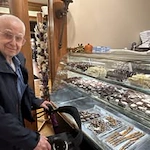 Camellia Gardens Gracious Retirement Living Hawthorn Senior Independent Living in Maynard, Massachusetts resident in front of a dessert case