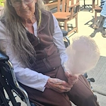 Fieldstone Memory Care of Marysville resident enjoys a sweet treat outside