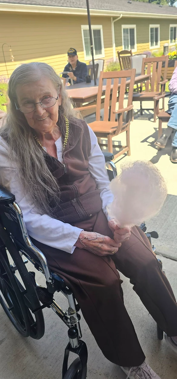 Fieldstone Memory Care of Marysville resident enjoys a sweet treat outside