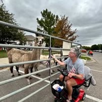 Ascension Living Via Christi Village Manhattan Senior Living in Manhattan, Kansas resident in a wheelchair at the petting zoo