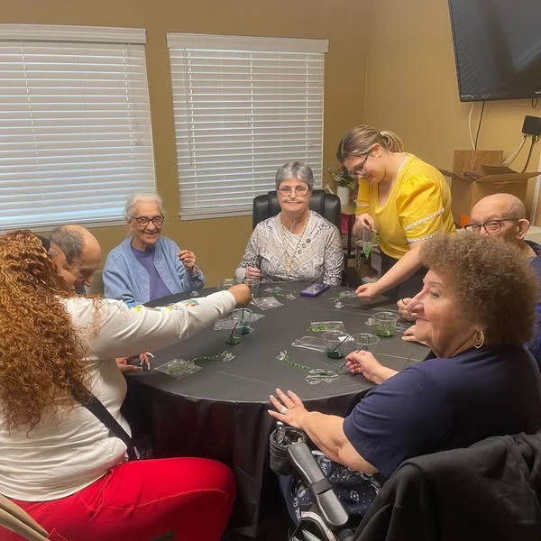 Whealdon Estates by Barclay House senior living community offering independent living in Baton Rouge, LA, residents celebrating St. Patrick's Day by making a craft