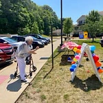 Parker Place Gracious Retirement Living Hawthorn Senior Independent Living in Mentor, Ohio resident playing an outdoor yard game