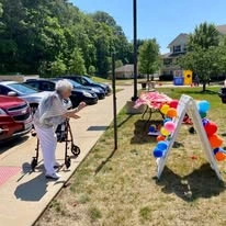 Parker Place Gracious Retirement Living Hawthorn Senior Independent Living in Mentor, Ohio resident playing an outdoor yard game